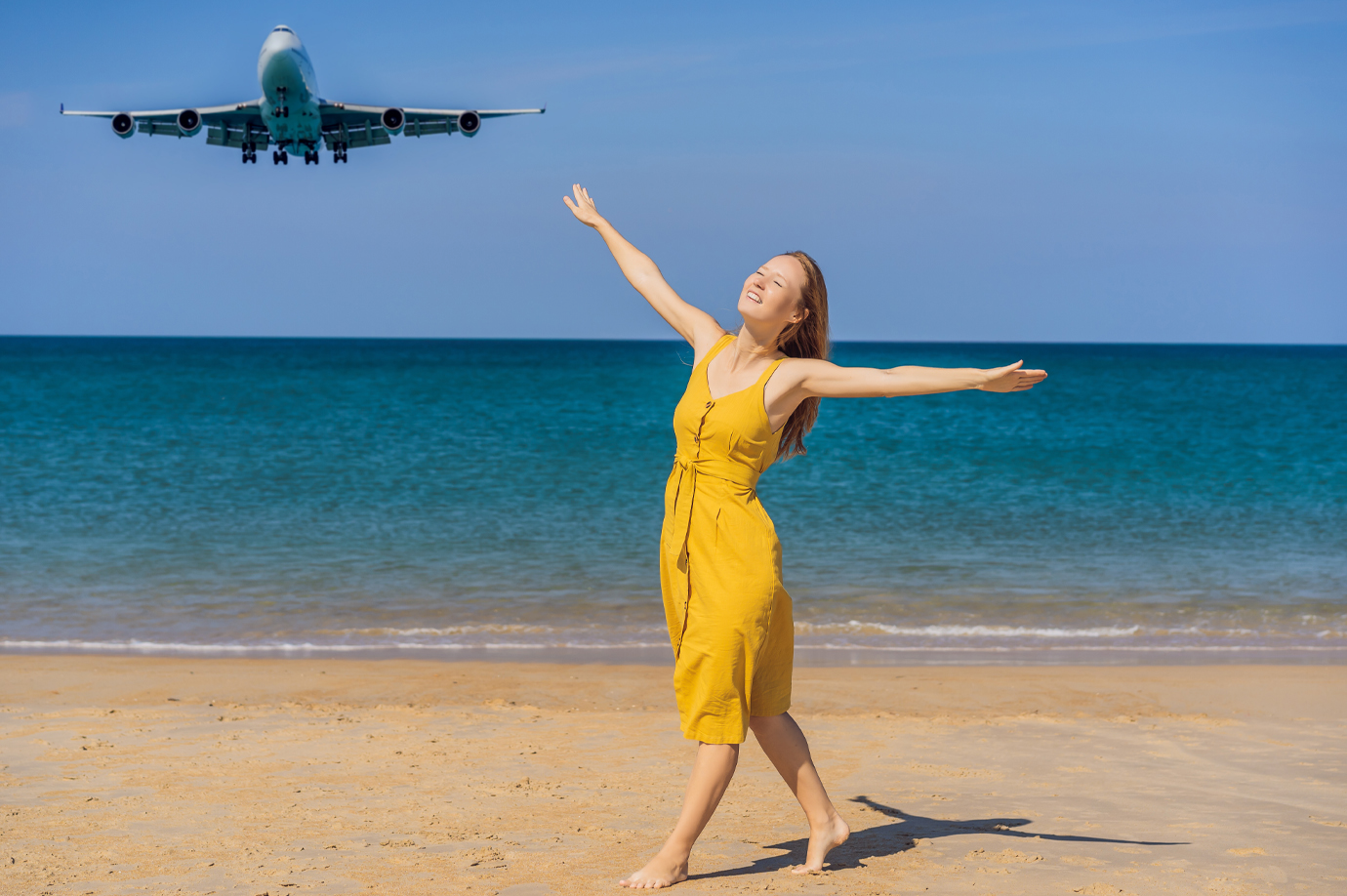 Bali Beach as a Plane Soars Overhead